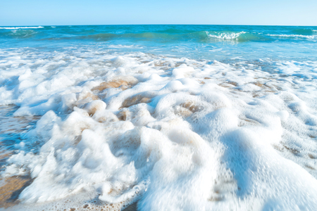 Tropical beach with sand and sea wave at background. Macro shotの写真素材