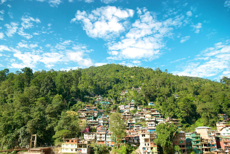 Houses in a town on green hill. India, Sikkim, Gangtokの写真素材