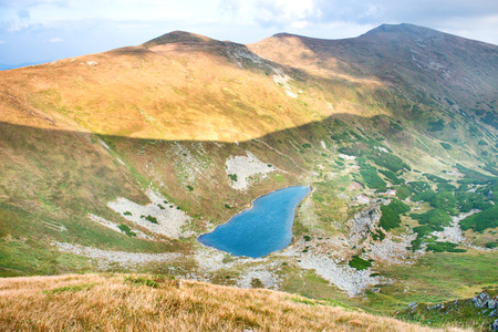 Blue lake in the mountains. Aerial viewの写真素材