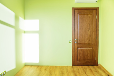 Living room interior of green empty room with door and wooden floorの写真素材