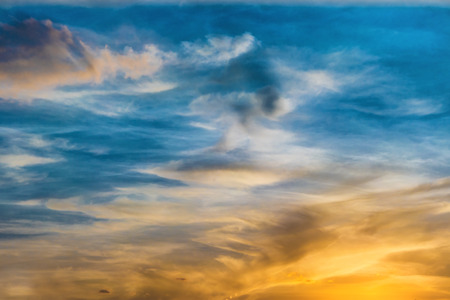 Beautiful dramatic sunset with sun and cloudsの写真素材