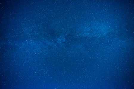 Dark blue night sky with many stars, galaxy backgroundの写真素材