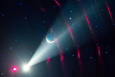 Disco ball and blue light ray on the stageの写真素材