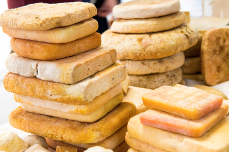 Various types of cheese on wooden deskの写真素材