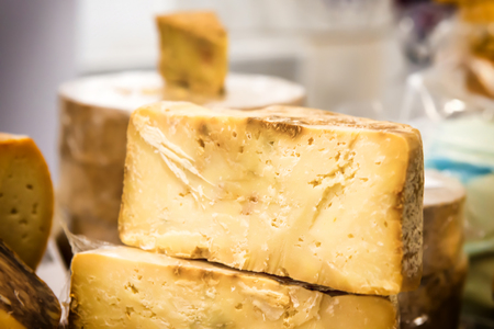 Various types of cheese on wooden deskの写真素材