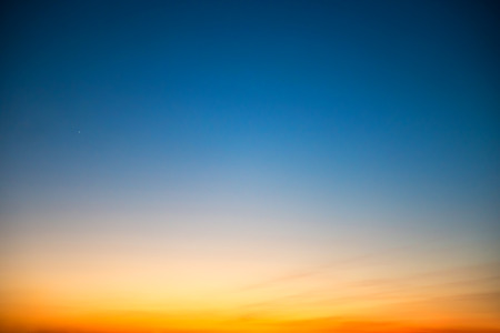 Sunset in the sky with blue, orange and red dramatic colorsの写真素材