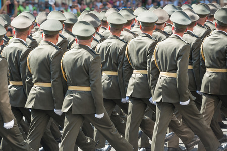Army soldiers in camouflage marching on military paradeの写真素材