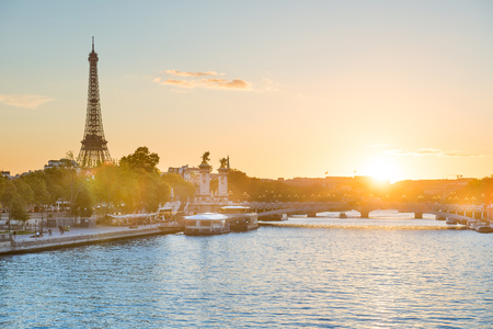 Beautiful sunset with Eiffel Tower and Seine river in Paris, Franceの写真素材