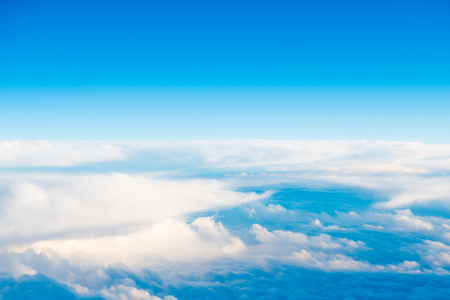 White clouds on blue sky as cloudscape backgroundの写真素材