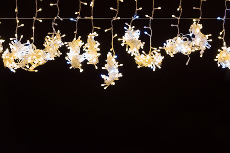 Christmas yellow lights on black for xmas holiday background