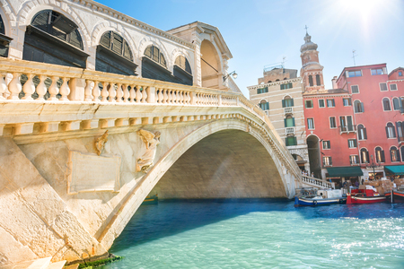Rialto bridge with sun on Grand canal in Veniceの写真素材