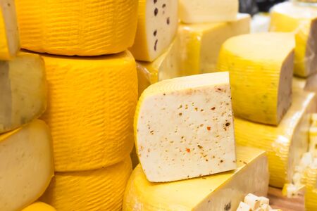 Various types of cheese on wooden deskの写真素材