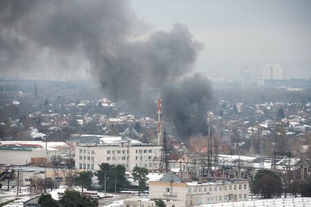 Fire in city on a industrial factory near mobile base stationの写真素材
