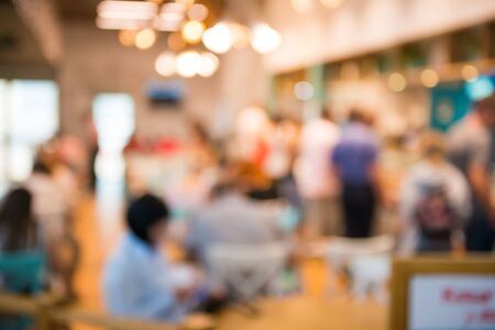Coffee shop interior with people as blurred cafe backgroundの写真素材