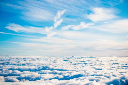 Aerial view of blue sky with layers of white fluffy cumulus