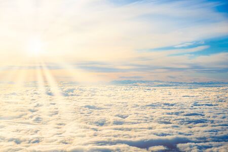 Aerial view of blue sky with layers of white fluffy cumulusの写真素材