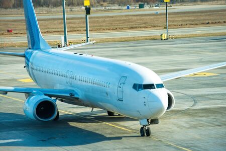 Big beautiful plane after flight standing on airport runway