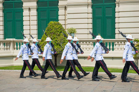 BANGKOK, THAILAND - FEBRUARY 08, 2020 : Ceremony of changing of royal guards in masks at Grand Palace complex during corona virus quarantine in Bangkok, Thailandのeditorial素材