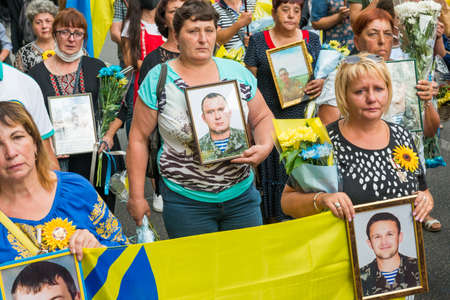 KIEV, UKRAINE - AUGUST 24, 2020: People with flags on March of defenders, parade in Kyiv, dedicated to the Independence Day of Ukraine, 29th anniversary.のeditorial素材