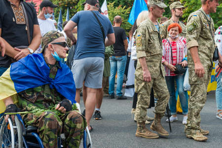 KIEV, UKRAINE - AUGUST 24, 2020: Disabled soldiers in wheelchairs on march of defenders, parade in Kyiv, dedicated to the Independence Day of Ukraine, 29th anniversary.のeditorial素材