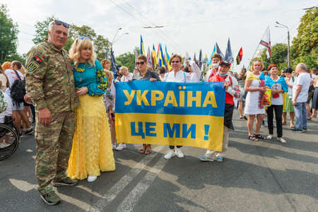 KIEV, UKRAINE - AUGUST 24, 2020: People with âUkraine is Usâ banner on march of defenders, parade in Kyiv, dedicated to the Independence Day of Ukraine, 29th anniversary.のeditorial素材