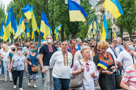 KIEV, UKRAINE - AUGUST 24, 2020: People with Ukrainian flags on March of defenders, parade in Kyiv, dedicated to the Independence Day of Ukraine, 29th anniversary.のeditorial素材
