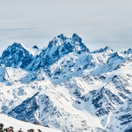 Snowy blue mountains in clouds. Winter ski resortの写真素材