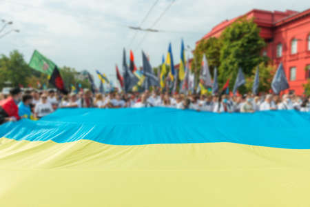 Crown of people with Ukrainian flag on March of defenders, parade in Kyiv, dedicated to the Independence Day of Ukraine, 29th anniversaryの写真素材