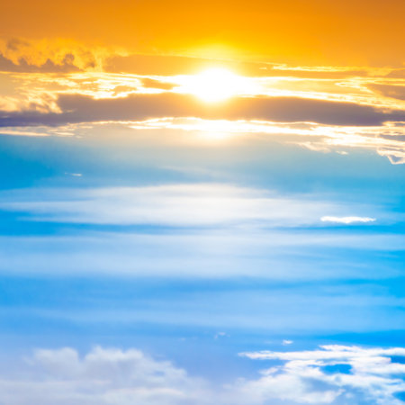 Sunset sky with sun rays and sunset cloudsの写真素材
