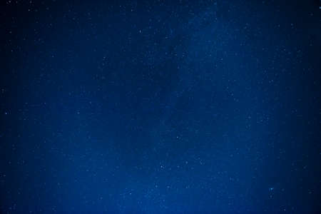 Dark night sky with many stars. Milky way night sky backgroundの写真素材