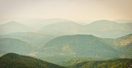Sunset mist mountains landscape, panorama of morning mountainsの写真素材