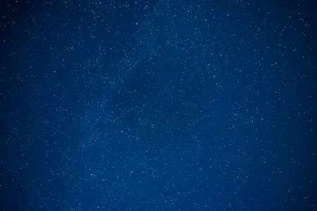 Dark night sky with many stars. Milky way night sky backgroundの写真素材