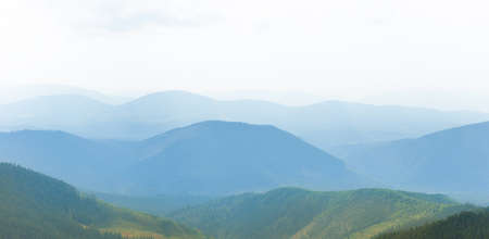 Sunset mist mountains landscape, panorama of morning mountainsの写真素材