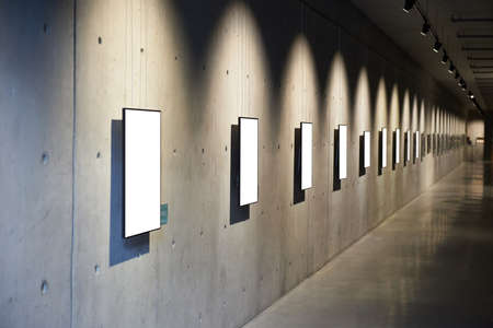 Empty blank white isolated frame on wallの写真素材