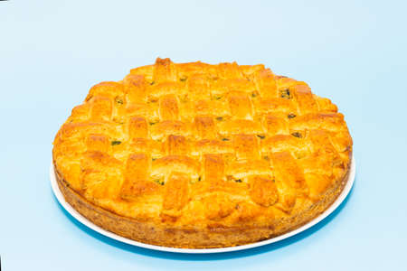American pie with baked crust on blue backgroundの写真素材