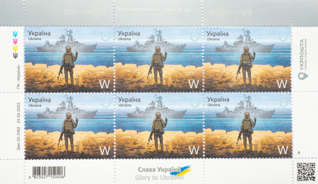 KIEV, UKRAINE - February 24, 2022: Ukraine post stamps with Ukrainian soldier defender of Zmiinyi island and russian warship cruiser Moskva. Russian warship idi na...のeditorial素材