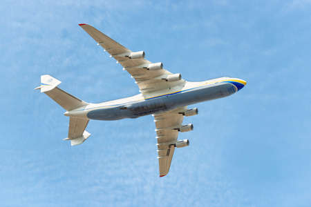 KIEV, UKRAINE - AUGUST 24, 2022: Mriya plane flight jet on blue sky. The biggest plane An-225 Mriya, destroyed by Russian occupants in Hostomel, Ukraineのeditorial素材