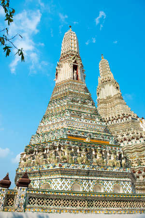 Side view of prangs or towers of Wat Arun - architectural landmark in Bangkok, Thailandの写真素材