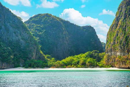 Panorama of Phi Phi famous island in Thailand with sea, boats and mountains in beautiful lagoon where the Beach movie was filmedの写真素材