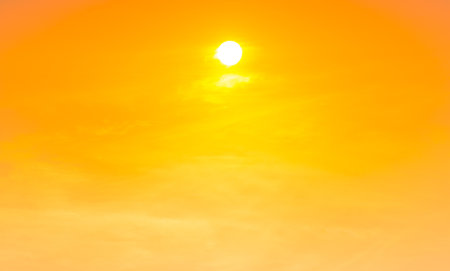 Sunset yellow sky with sunset sun and sunset yellow cloudsの写真素材