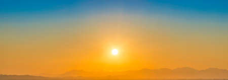 Mountains sunset panorama landscape with sunset skyの写真素材