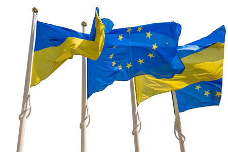 Flagpoles with European Union and Ukraine flags isolated on white backgroundの写真素材