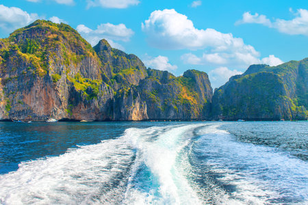 Landscape Phi Phi island in Thailand with sea, mountains and wave from boatの写真素材