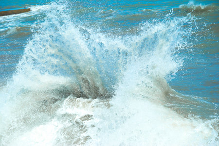 Big wave with sea foam and blue waterの写真素材