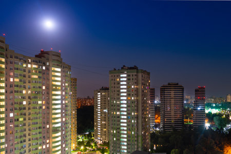 City at night, city night street with buildings and night moon light.の写真素材