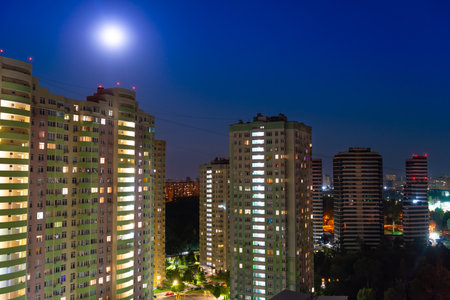 City at night, city night street with buildings and night moon light. Kyiv city, Ukraineの写真素材