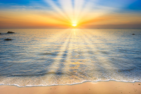 Beach sunset with sea sunset sun on sunset cloudsの写真素材