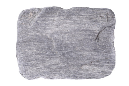 Gray grey flat stone isolated on white backgroundの写真素材