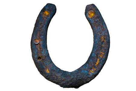 Old rustic horseshoe. Rust horse shoe for luck isolated on white backgroundの写真素材