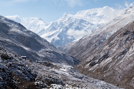View of Annapurna III and Gangnapurna from Jharsang Khola valley near Yak Kharka on Round Annapurna trek (Annapurna Circuit) in Himalaya mountains, Annapurna Conservation Area, Manang, Nepal.の写真素材